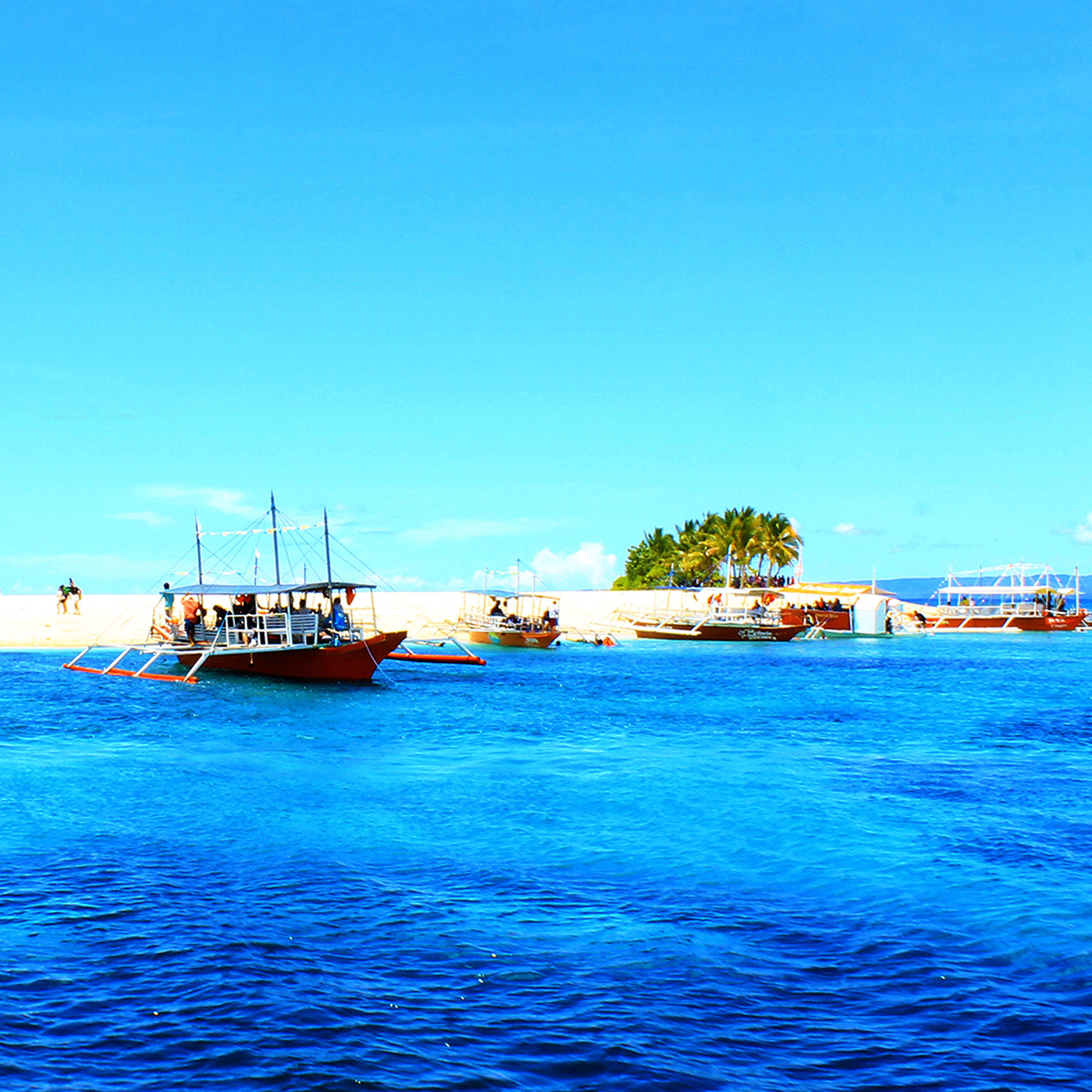 <b class="font-bara"><i class="bi bi-geo-fill h4"></i> HAGONOY ISLET</b> <br/>Coined as the “Lovers Islet”, it is a perfect romantic getaway for couples and a romantic venue for their honeymoon and pre-nuptial pictorials. It has the widest shoreline best for picnics, beach sports and other recreational activities. The islet is good for skiing and surfing when the waves reach 15 to 20ft rough.
